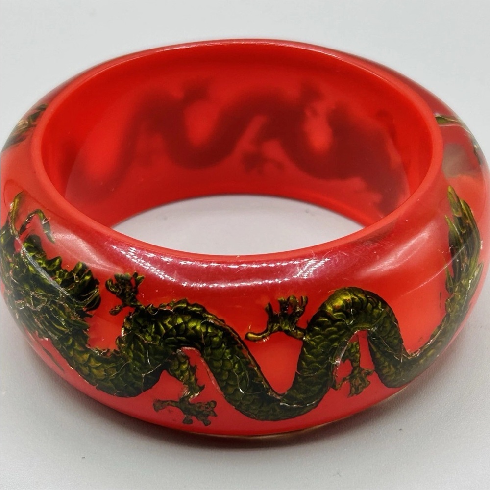RED BANGLE with Shiny Black w/Gold Dragons Embedded in Clear Resin backed in Red